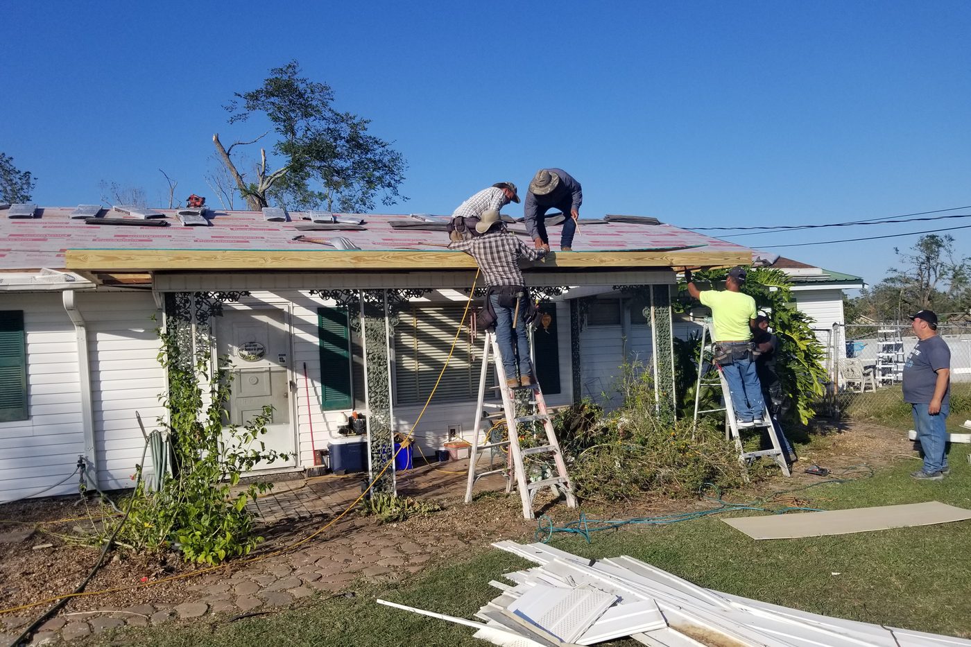 RoofMax USA crew rebuilding a storm-damaged roof deck on a metro Atlanta home